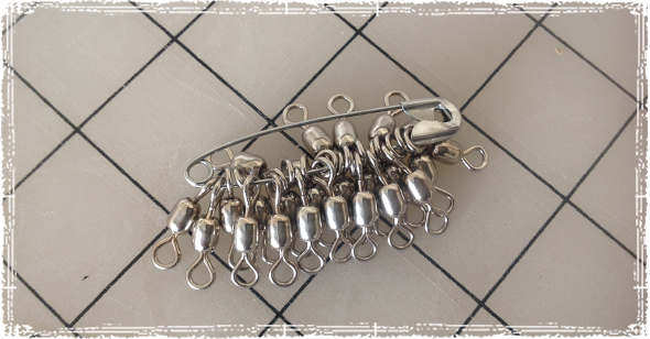 Using a safety pin to organize all those tiny swivels can be a huge help.