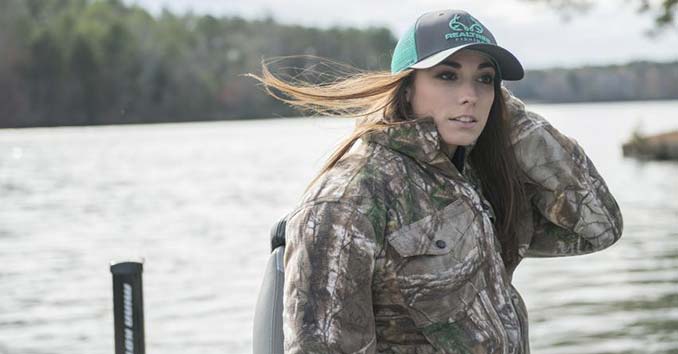 Woman wearing Realtree Gear and a Realtree Fishing Hat