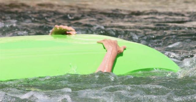 Guy getting into trouble on a Kayak