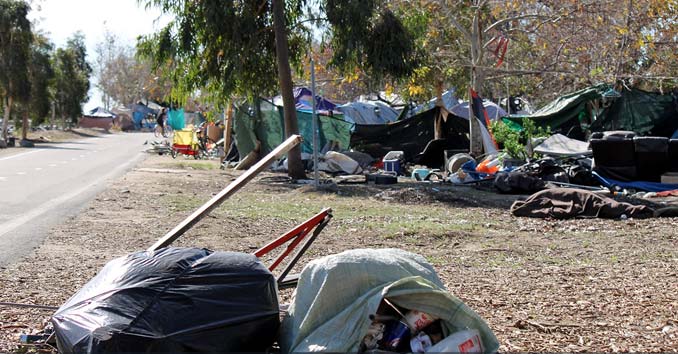 homeless camp near river in California